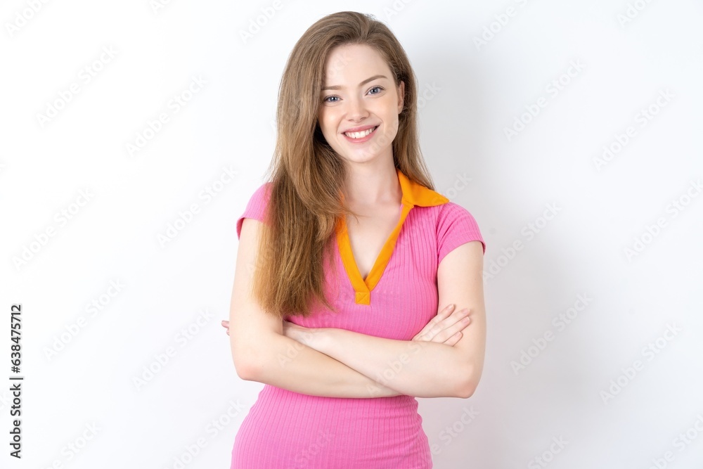 young beautiful red haired woman   happy face smiling with crossed arms looking at the camera. Positive person.