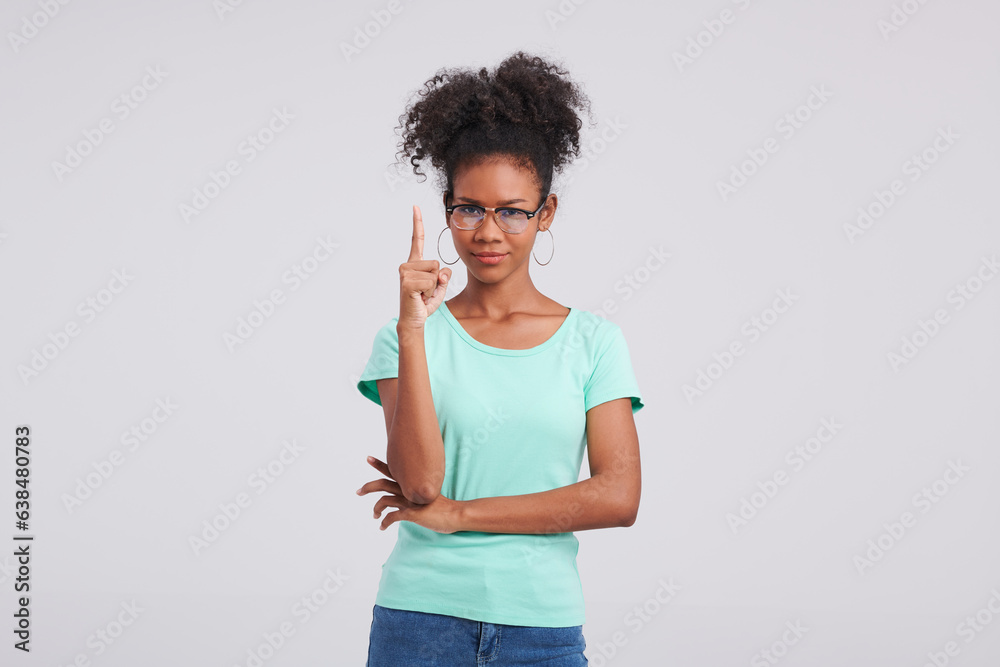 Effortlessly cool vibes as a woman rocks a mint shirt, blue jeans, and chic glasses in a studio fashion session. Effortlessly cool vibes as a woman rocks a mint shirt, blue jeans, and chic glasses in a studio fashion session.