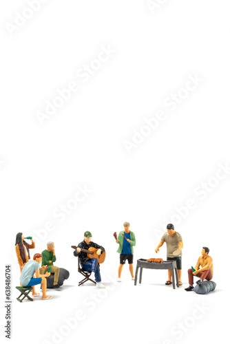 Miniature people are making barbeque, drinking beverages isolated on white background © wassamon