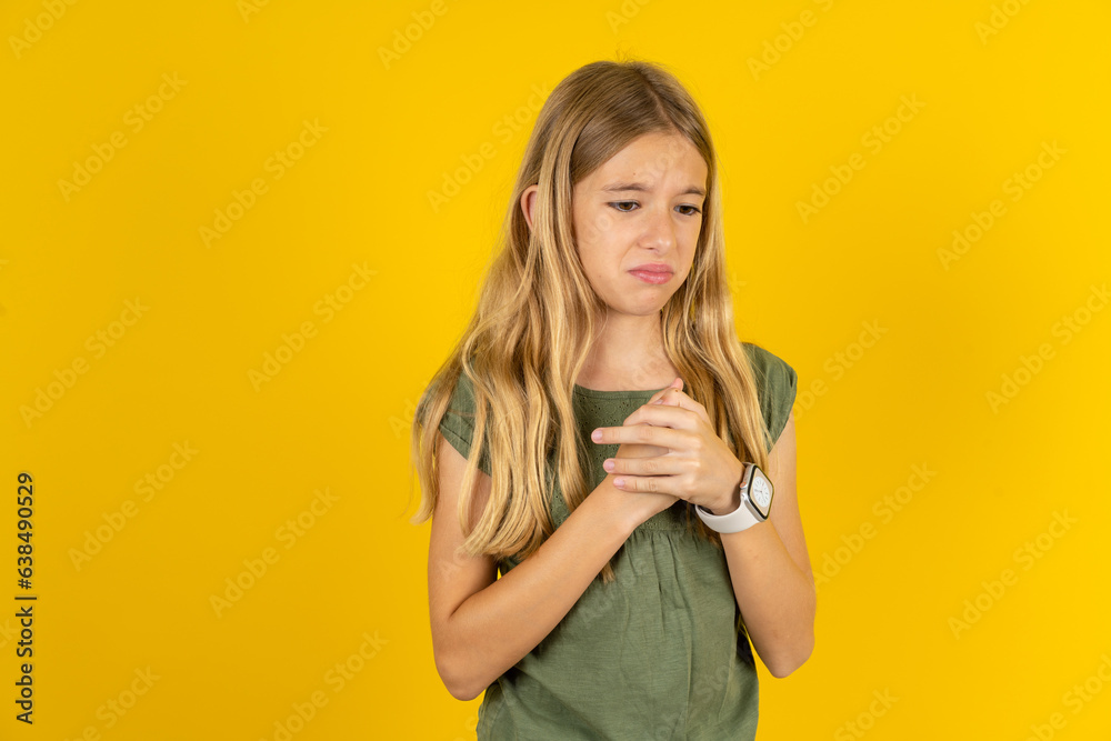 Sad Beautiful caucasian kid girl wearing green dress desperate and depressed with tears on her eyes suffering pain and depression in sadness facial expression and emotion concept Sad Beautiful caucasian kid girl wearing green dress desperate and depressed with tears on her eyes suffering pain and depression in sadness facial expression and emotion concept