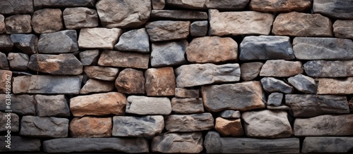 Background of a stone wall made from natural rocks