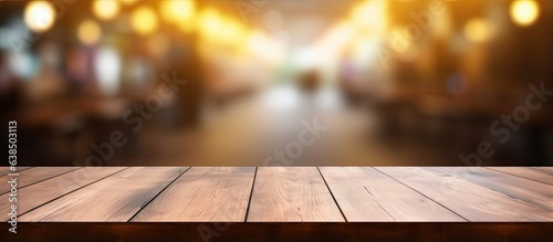 Brown wooden table with a blurred coffee shop background for photography or showcasing products