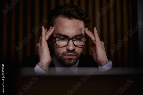 You shouldnt have to think twice about going online. a handsome young businessman sitting behind his laptop in his office.
