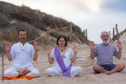 Practicing kundalini yoga on the beach