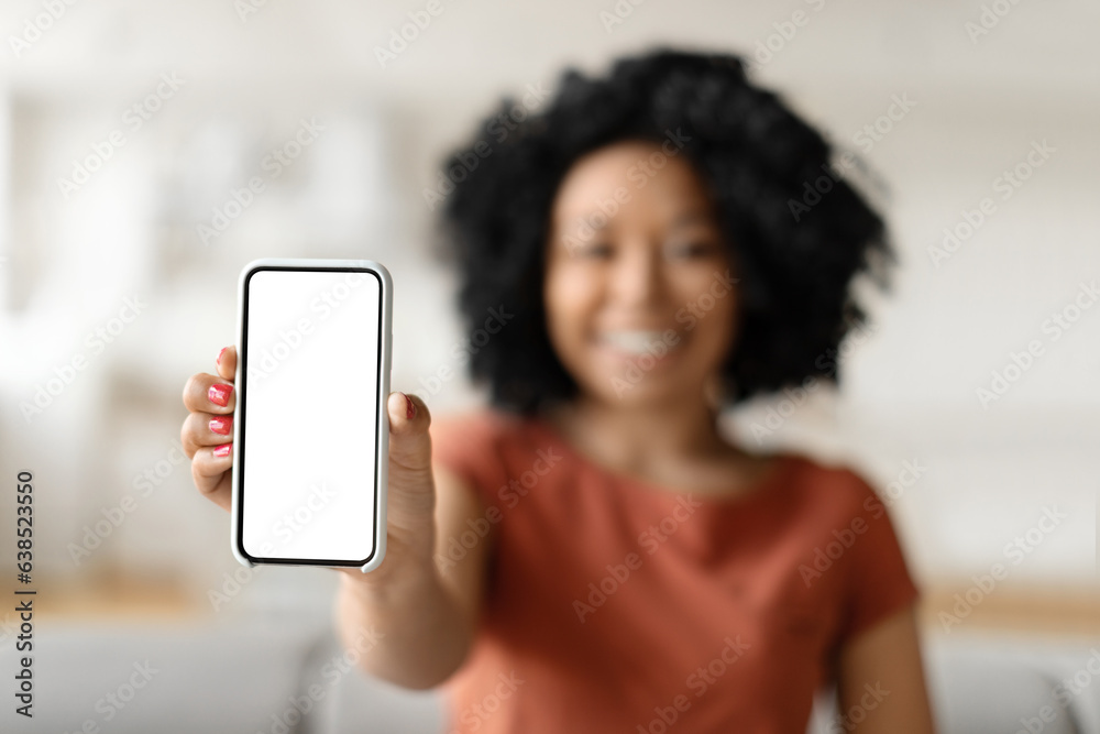 Great App. Smiling Black Lady Holding Smartphone With Blank Empty Screen