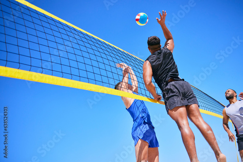 Beach volleyball match, blue sky and sports team jump, playing competition and practice for tournament challenge. Below view, athlete action and people in air workout, training or nature exercise