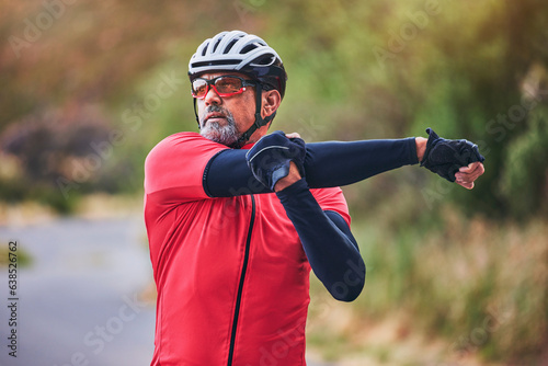 Man, cyclist and stretching arms on mountain in sports fitness, workout or outdoor exercise in nature. Active male person or athlete in body warm up, cycling or ready for cardio marathon or training