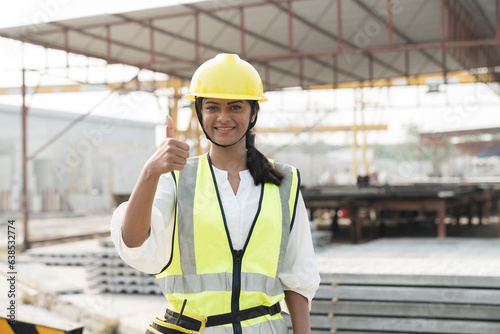 Portrait of female construction worker at construction site. Asian woman construction worker working at construction site