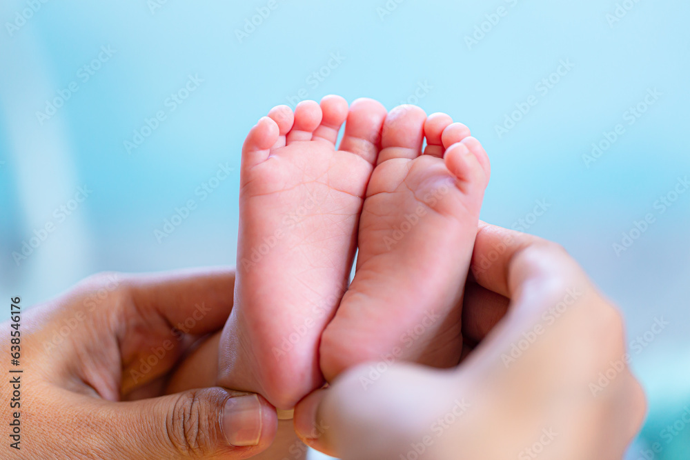 baby feet,Baby feet in hands, tiny newborn baby feet on hands, female close-up portrait, mother and her baby, happy family concept, beautiful conception image of childbirth.