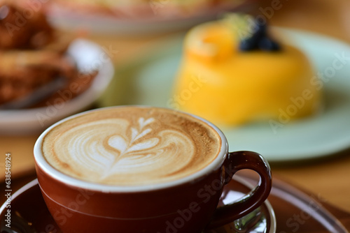 high angle view of coffee cup on wood grain table Drinking Concept: Hot Coffee, Latte, Espresso, Cappuccino