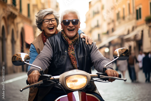 Happy senior couple having fun! Riding motor bike scooter across the town and waving! Retirement adventure life. © Uros