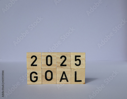 Wooden blocks 2025 on a purple background. concept new plans, goals, motivation, reboot, countdown. template for a postcard. happy new year