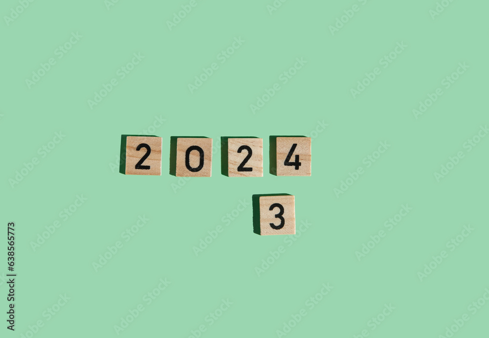 wooden blocks with the numbers 2024 on green background. The concept of the beginning of the new year 2024. template for banners, postcards. Happy New Year wooden blocks with the numbers 2024 on green background. The concept of the beginning of the new year 2024. template for banners, postcards. Happy New Year