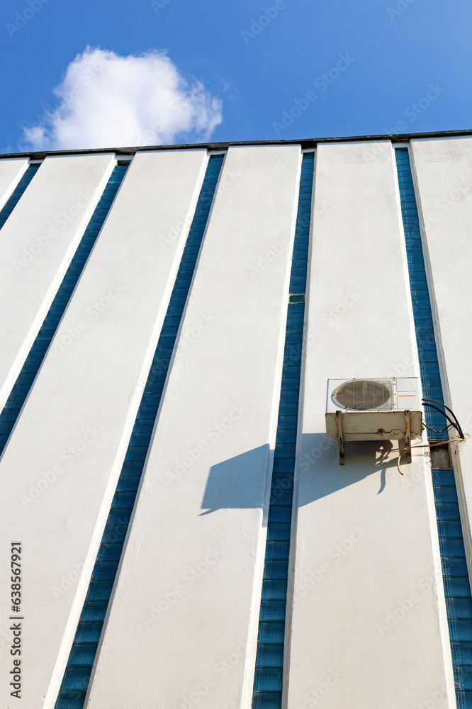 Heat pump. Air conditioning compressor on outside wall. Extra long shot, copy space.