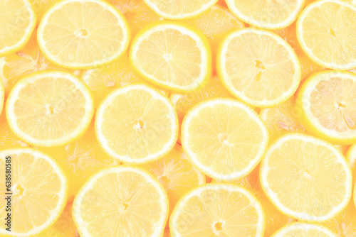 A slices of fresh juicy yellow lemons. Texture background, pattern