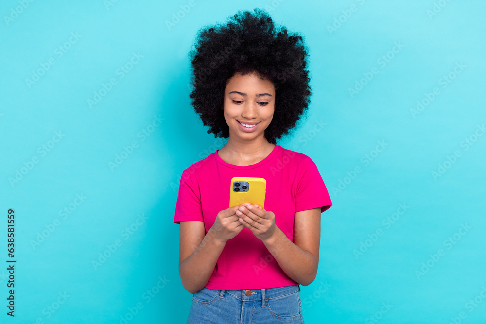 Photo of charming sweet small lady wear pink t-shirt communicating instagram twitter telegram facebook isolated turquoise color background