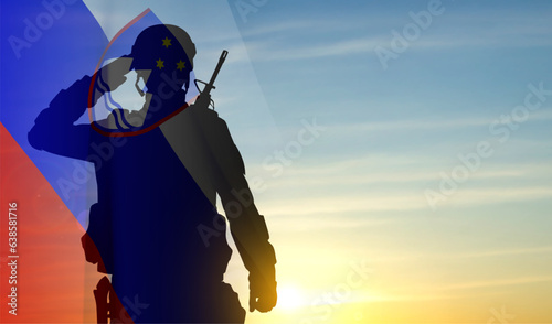Silhouette of a soldier with Slovenia flag against the sunset. EPS10 vector