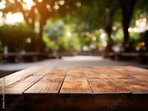 Wooden floor perspective and green forest with ray of light.
