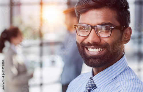 concentrated businessman with beard wearing glasses portrait