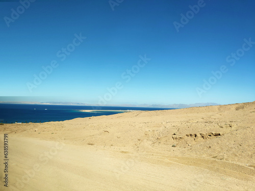 Fototapeta Naklejka Na Ścianę i Meble -  Desert land with mountains and sea