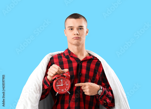 Young man in pajamas, with ...