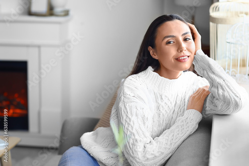 Relaxed young woman in cozy...