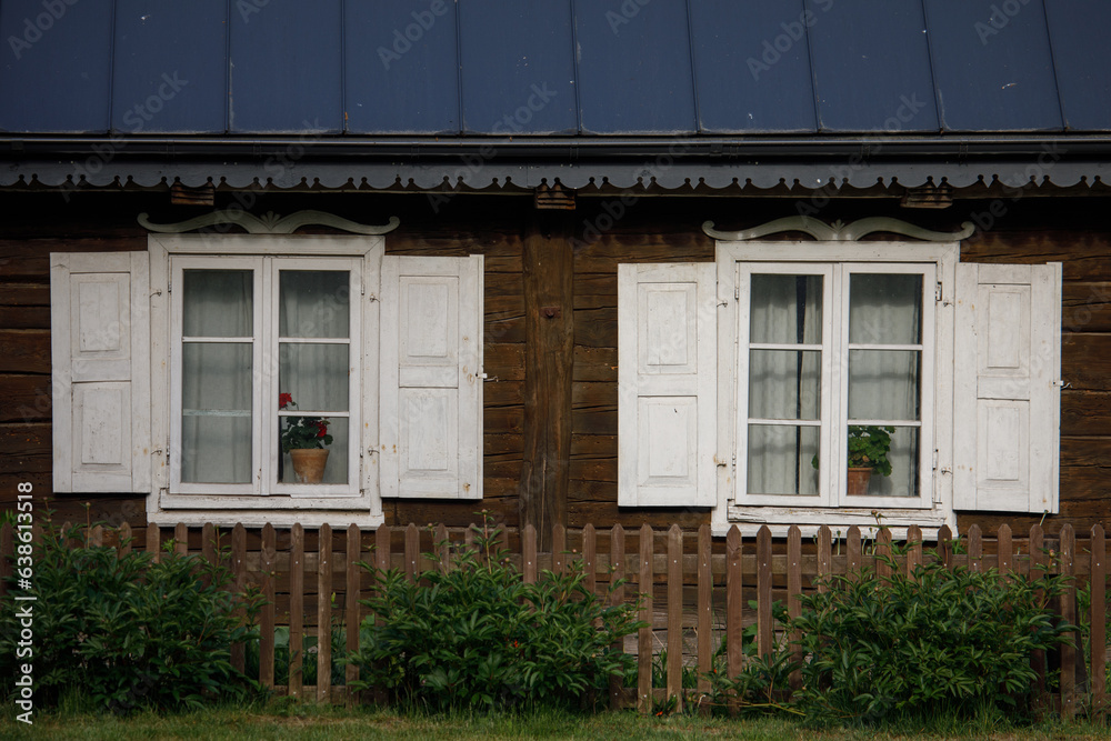 Fototapeta premium Traditional lithuanian house detail - windows with traditional ornaments