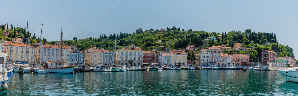 A panorama view across the outer harbour towards the town of Piran, Slovenia in summertime