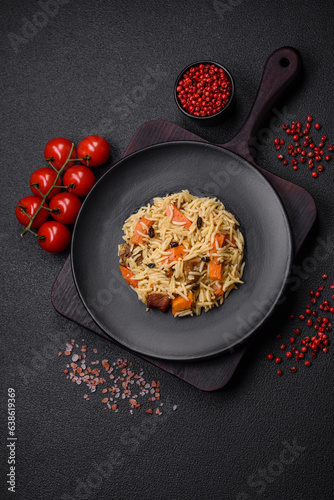 Delicious Uzbek pilaf with chicken, carrots, barberry, spices and herbs