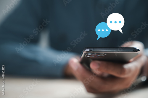 Obraz na plátně Mans hand uses smartphone to type live chat and social network concepts