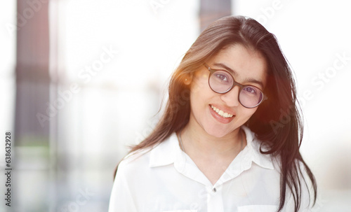 A close up head shot portrait of a preppy, young, beautiful, confident and attractive woman