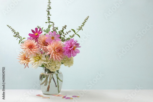 Fototapeta Naklejka Na Ścianę i Meble -  Beautiful dahlia flowers in a vase, abstract floral arrangement, autumn background with place for text, minimal holiday concept, still life, postcard. Happy birthday greetings