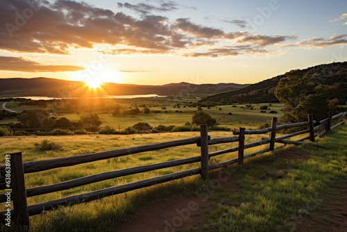 A New Day's Promise: Gazing upon the Idyllic Beauty of a Fenced Ranch in a Picturesque Sunrise Landscape