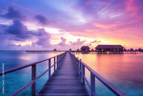 Luxury Haven in Twilight Glow: Beautiful Island Sunset Panorama with Illuminated Resort Villas 