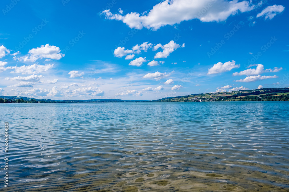 Beautiful view of Lake Sempach with blue cloudy sky - Sempach, Switzerland