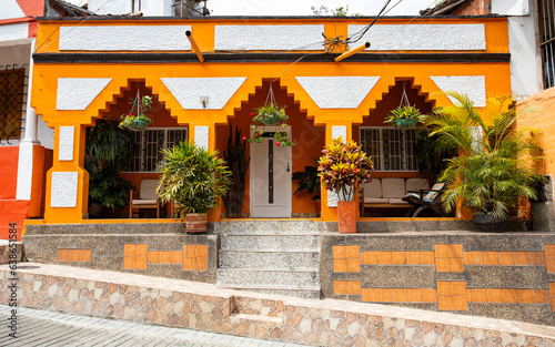Traditional Colombian architecture, typical facade of symmetrical colors - Heliconia, Antioquia