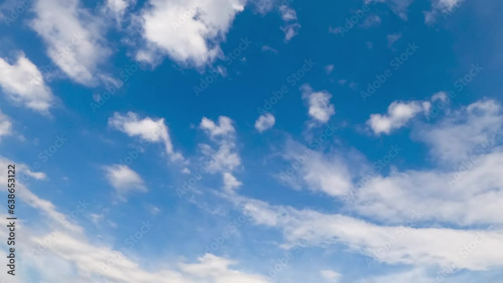 Beautiful little white clouds fly in the sky and disperse in the wind. Low angle view. Timelapse. Beautiful little white clouds fly in the sky and disperse in the wind. Low angle view. Timelapse.