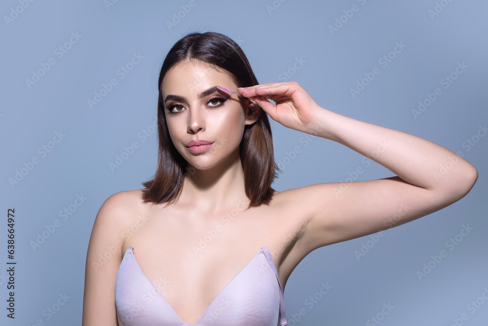 Woman shaping brown eyebrows. Woman eye with beautiful eyebrows. Shaped brows, long eyelashes. Paint eyebrows. Girl contouring eyebrows on isolated studio background. Woman shaping brown eyebrows. Woman eye with beautiful eyebrows. Shaped brows, long eyelashes. Paint eyebrows. Girl contouring eyebrows on isolated studio background.