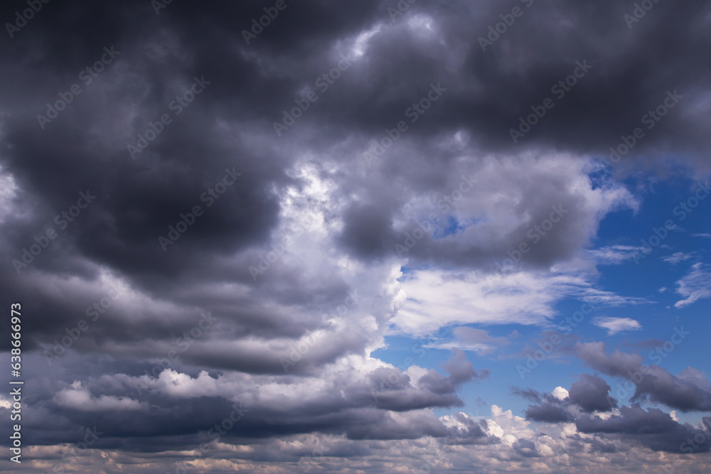 Storm cloudy dramatic sky with dark rain grey cumulus cloud and blue sky background texture, thunderstorm Storm cloudy dramatic sky with dark rain grey cumulus cloud and blue sky background texture, thunderstorm