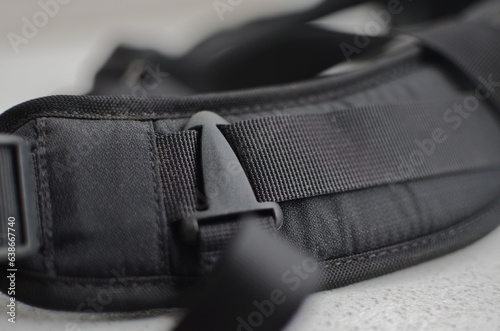 Black suspender or belt close-up, elegant and high-quality accessory to complete your style. Concept for backpacks or military accessories.