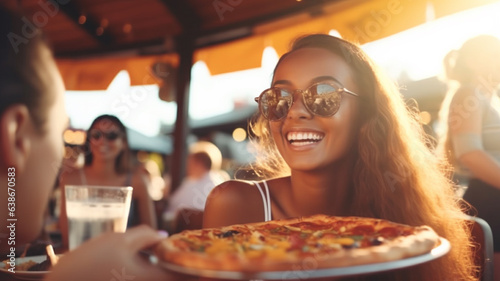 fun and friends meeting friends at sunset in a pizzeria in the outdoor area of the gastronomy eating pizza, radiantly happy and hungry