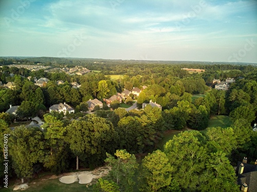 Aerial panoramic view of an upscale subdivision shot during golden hour.