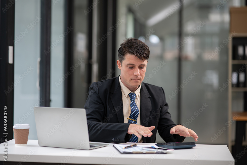 Businessman talking to customers online together at the office. Businessman talking to customers online together at the office.