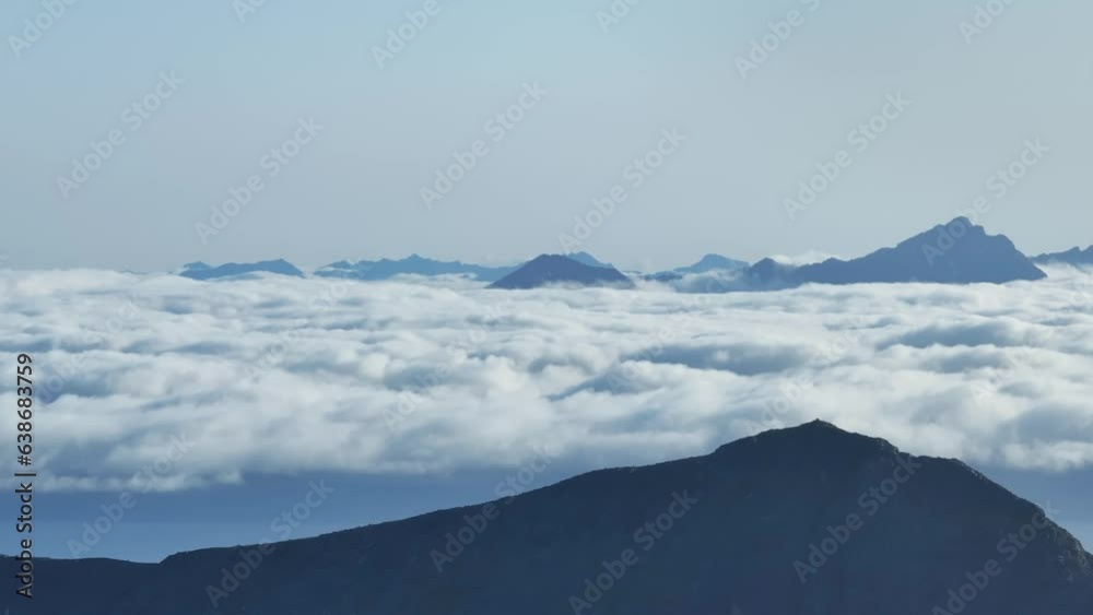 Aerial View of Sea Of Clouds Behind The Mountain Peak In Norway. Aerial View of Sea Of Clouds Behind The Mountain Peak In Norway.