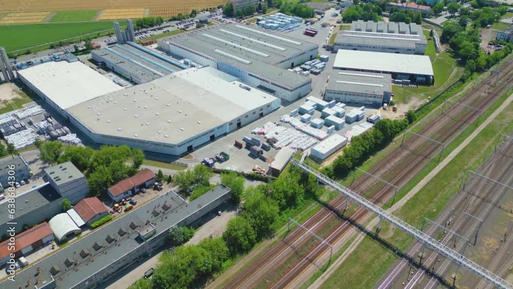 Aerial view of goods warehouse. Logistics center in industrial city zone from above. Aerial view of trucks loading at logistic center Aerial view of goods warehouse. Logistics center in industrial city zone from above. Aerial view of trucks loading at logistic center