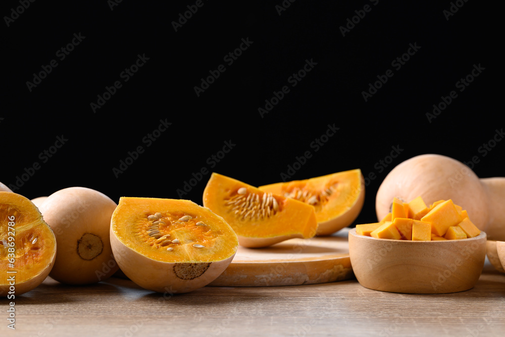 Sliced butternut squash pumpkinon wooden table with black background, Organic vegetable in autumn season