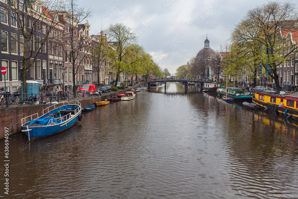 Canal and houses of Amsterdam. Amsterdam is the capital and most populous city of the Netherlands.