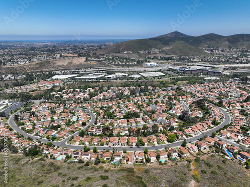 Fototapeta Naklejka Na Ścianę i Meble -  Aerial view of small city Poway in suburb of San Diego County, California, United States. Houses next the valley during dry season