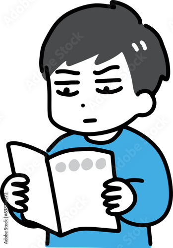 真剣に冊子を読む若い男性