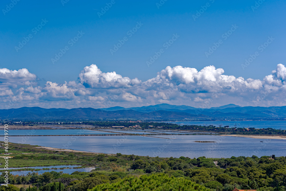 Aerial view from Giens peninsula on a sunny spring day with Mediterranean Sea and mountain panorama in the background. Photo taken June 8th, 2023, Giens, Hyères, France.